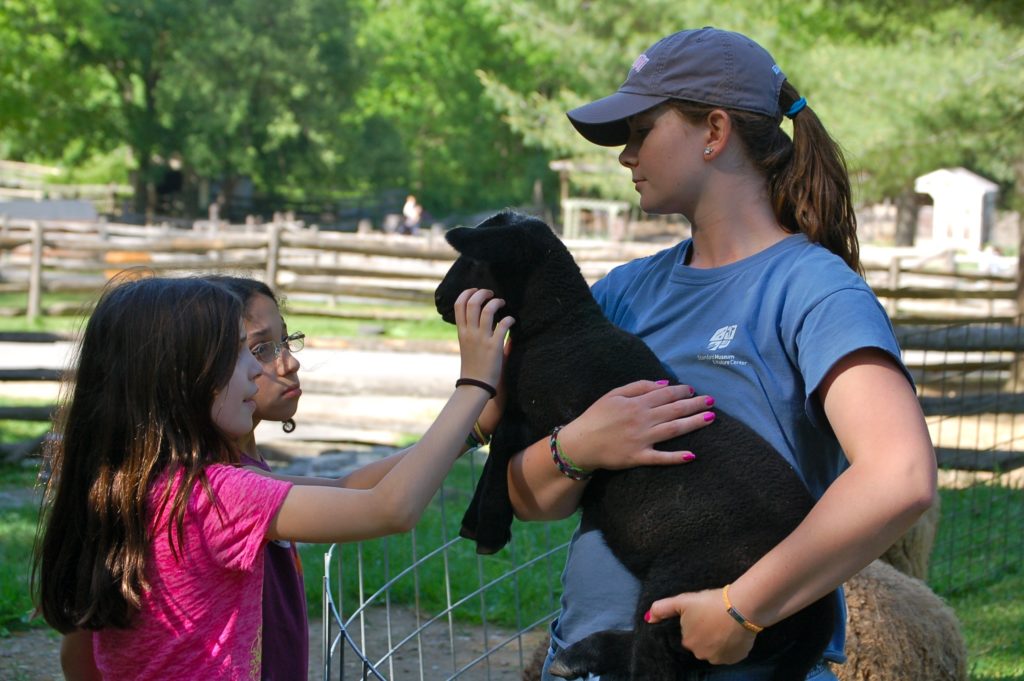 Woman_child_petting_goat